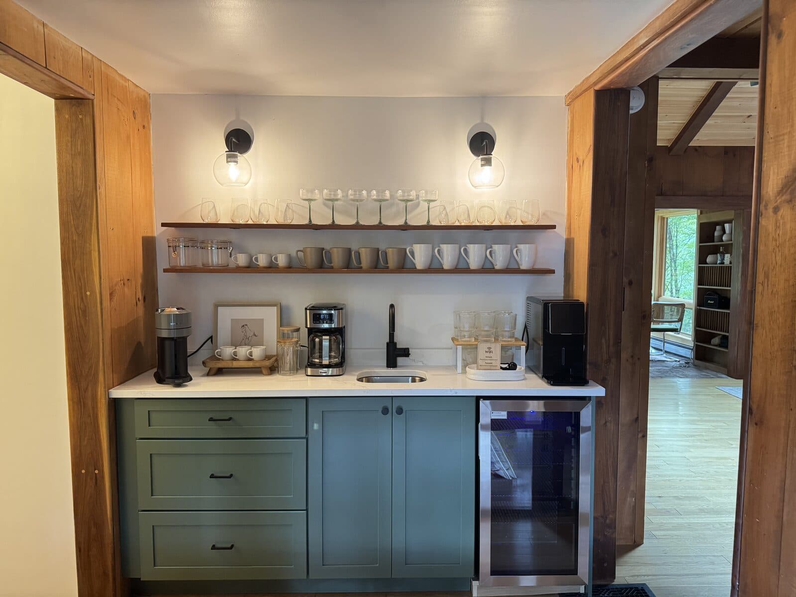 Guest coffee bar with glassware, mugs, and coffee service staged after VelocityMaid preparation